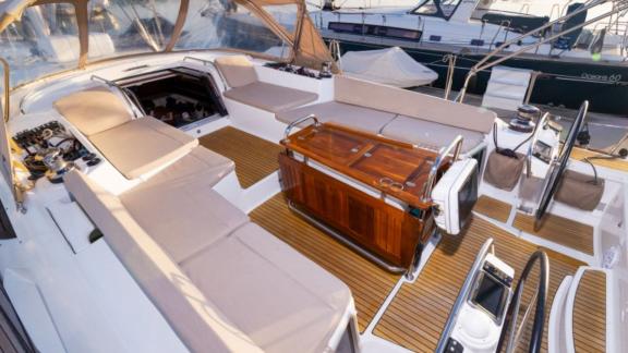 The spacious seating area on Whyknot yacht is equipped with comfortable cushions.