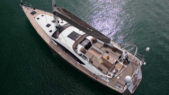 The deck of the Whyknot yacht stands out with its comfortable seating areas and stylish design.