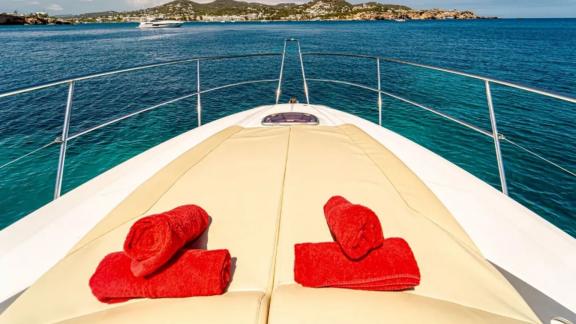 Comfortable sunbathing area on motor yacht Xenia with a sea view.