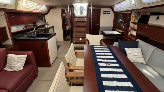 The spacious interior of the Yannis 65S features a modern kitchen and seating area.