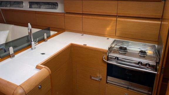 The kitchen of the Yerdeniz sailing yacht is equipped with modern appliances and a spacious countertop.