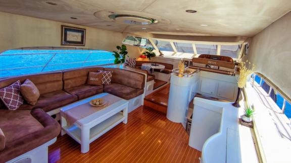 The interior of motor yacht Zeus 1 features comfortable seating areas and elegant decoration.