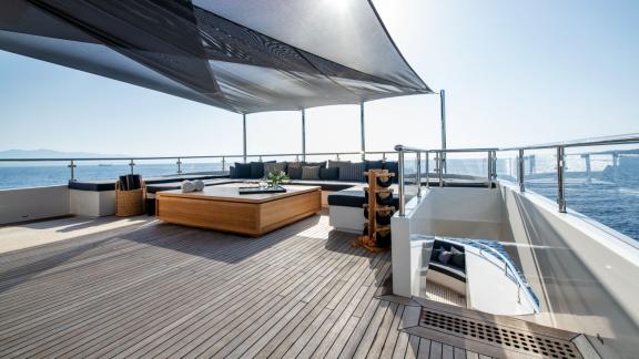 Relax on the stylish sun lounge of your yacht with breathtaking views.