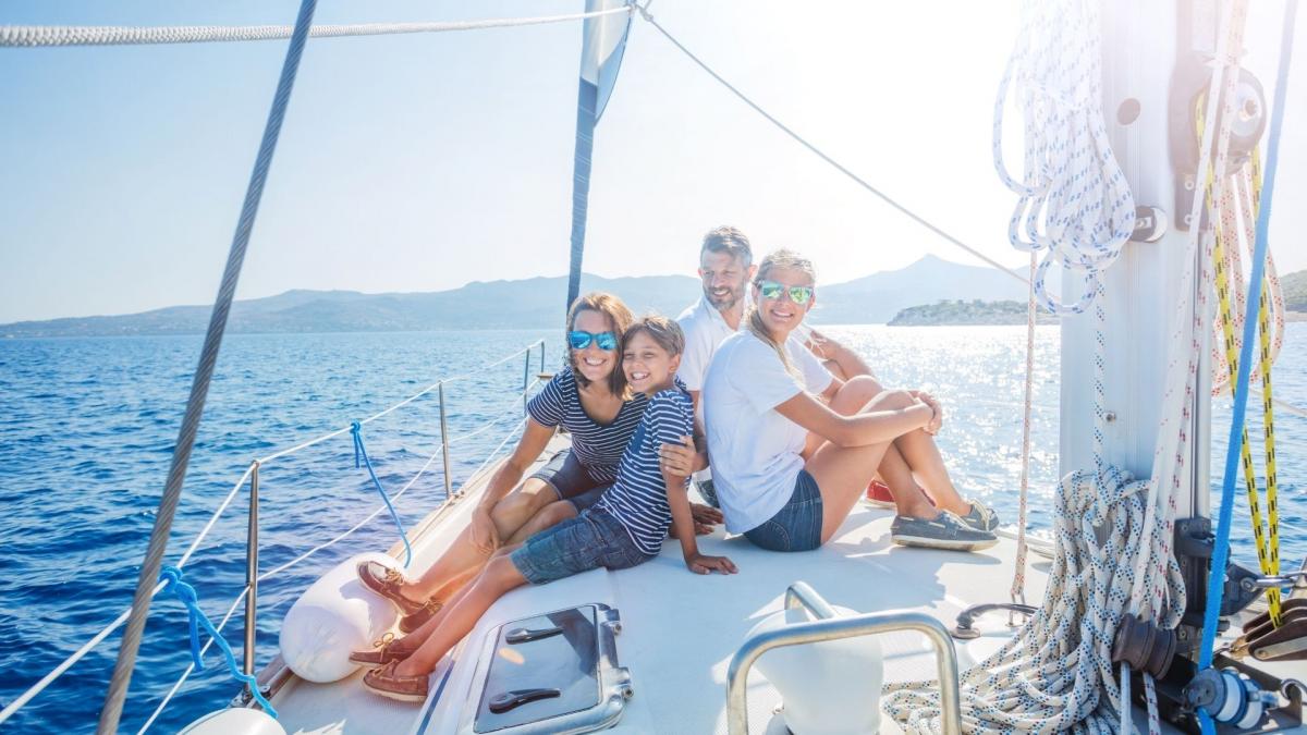 A family travels happily on the boat.