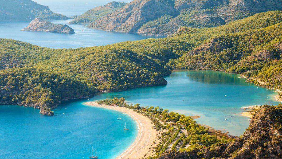Aerial view of Fethiye: turquoise blue sea surrounded by lush greenery