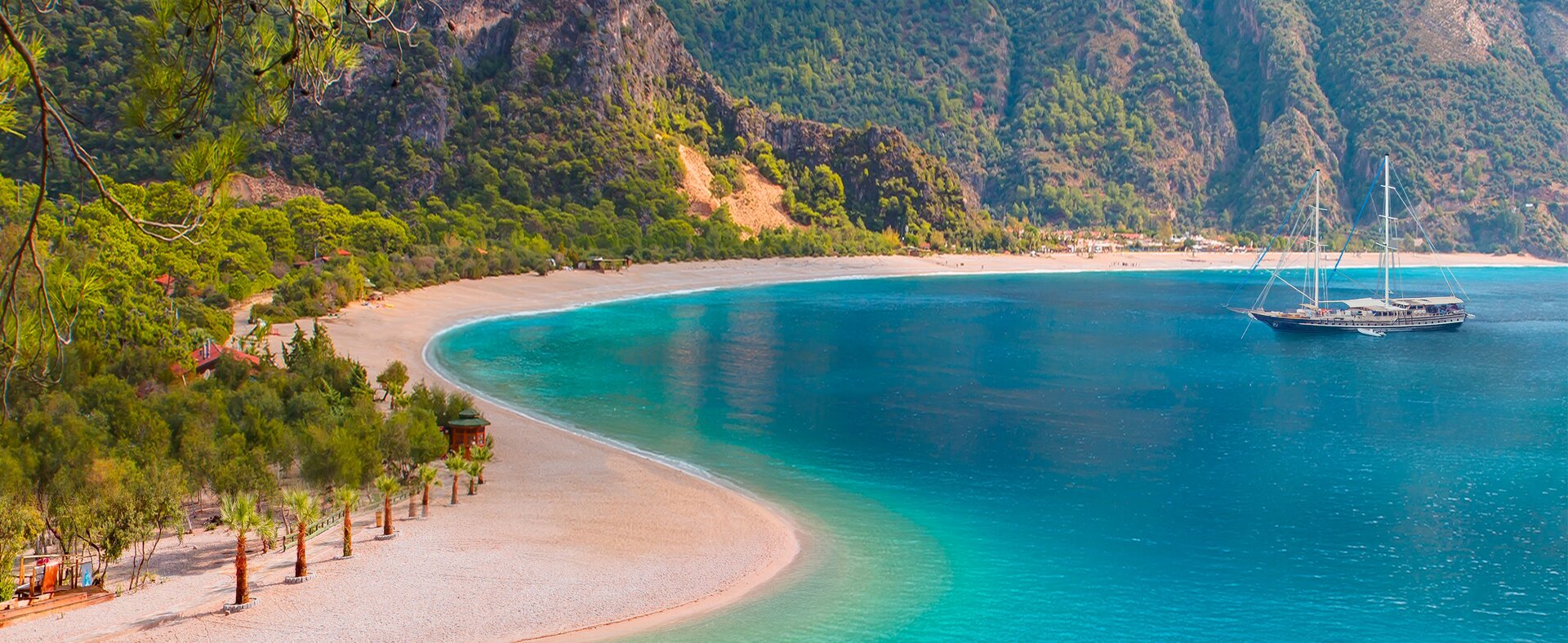 secluded bay view of a traditional wooden yacht during a Gocek gulet charter experience in Turkey