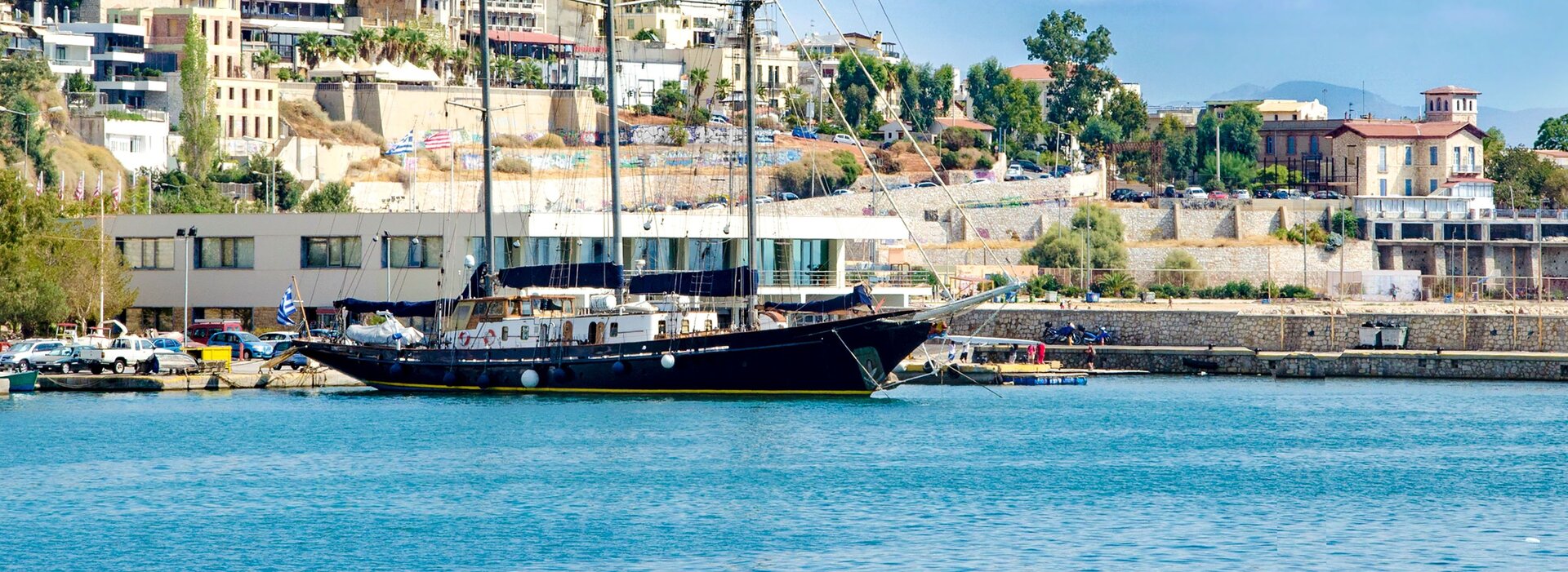 Luxury yacht moored in a harbor, prime scene for your luxury sailing yacht charter in Athens