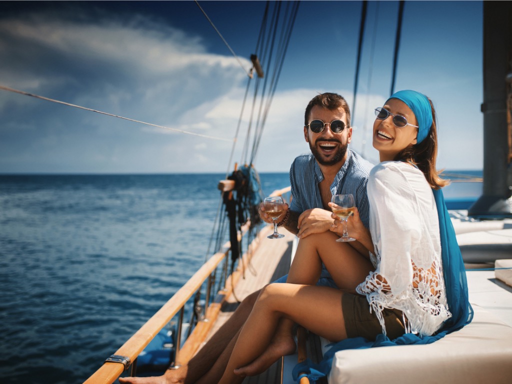 Young couple on a sailing cruise.